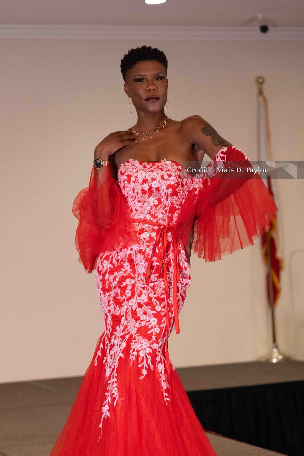 DivineWear crimson lace mermaid gown on original runway model