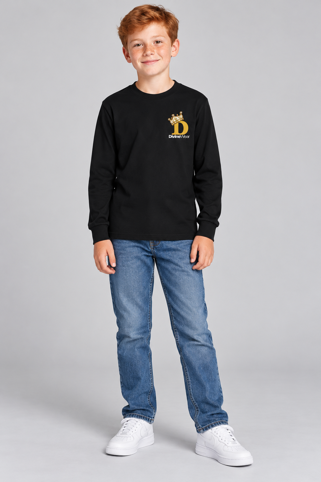 Irish youth model wearing the black DivineWear Kids Club crown long sleeve tee