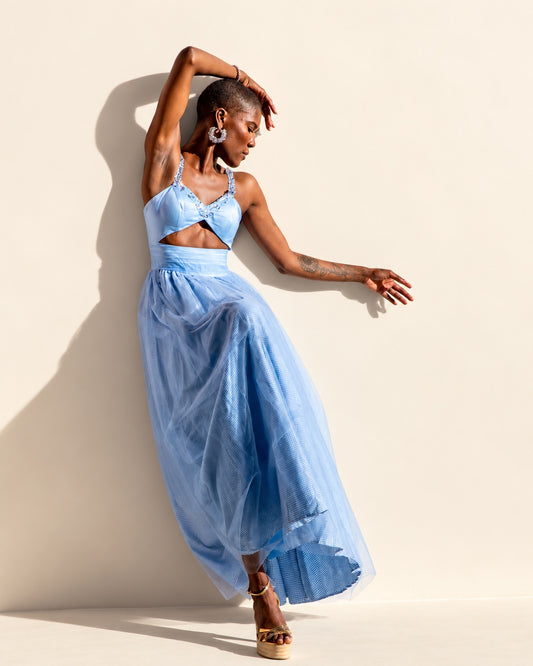 Light blue cutout dress with embellished straps and flowing sheer tulle overlay skirt