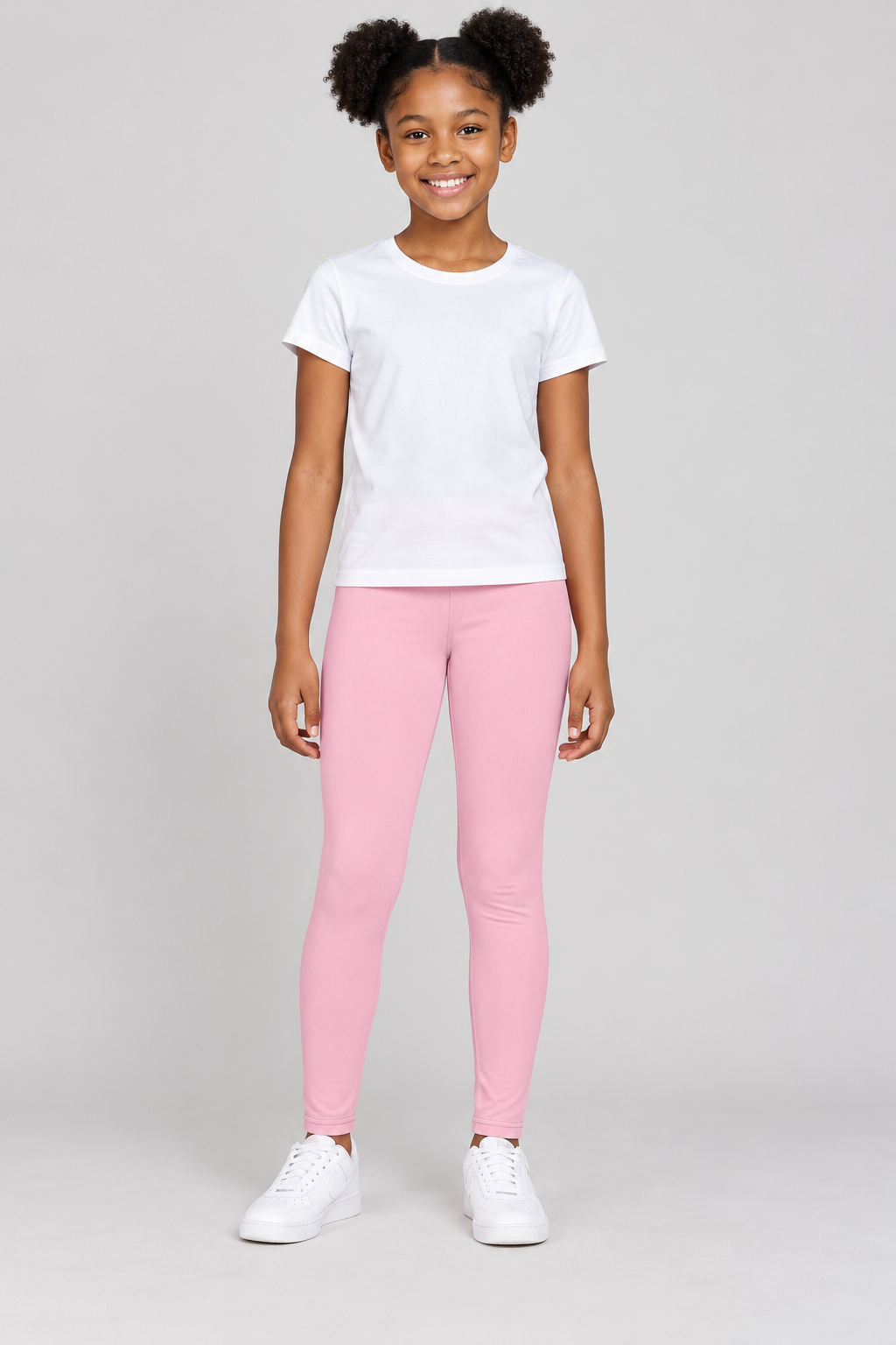 African American girl modeling DivineWear Kids Club pink youth leggings