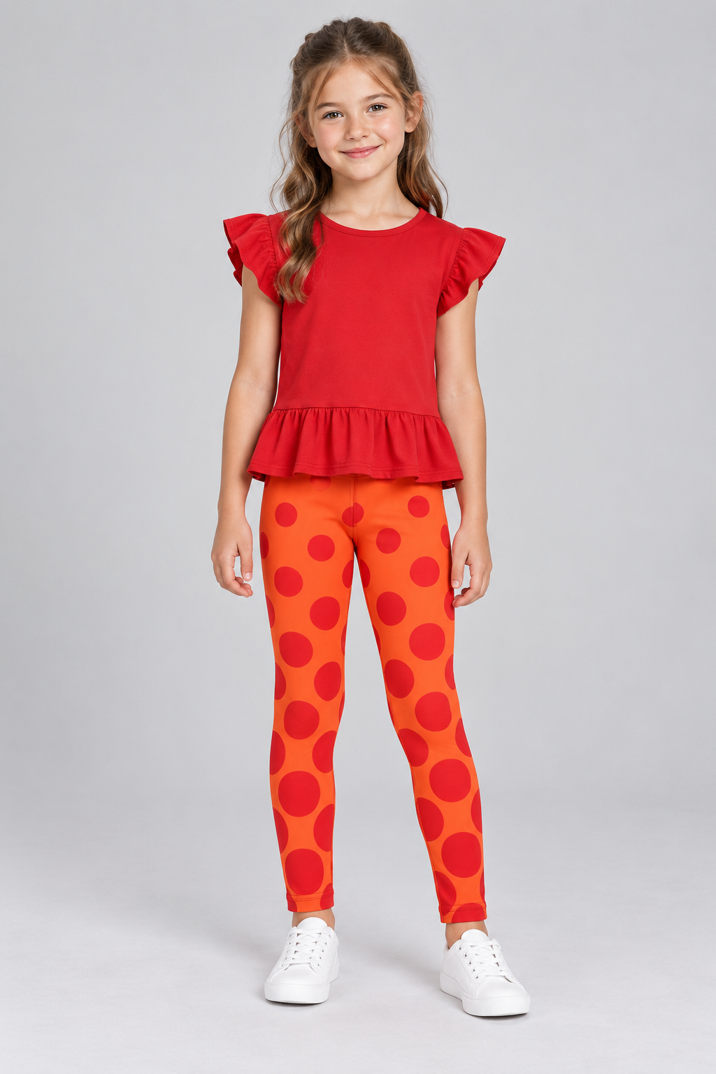 Russian youth model wearing Polka Dot Princess leggings styled with a red frilly top