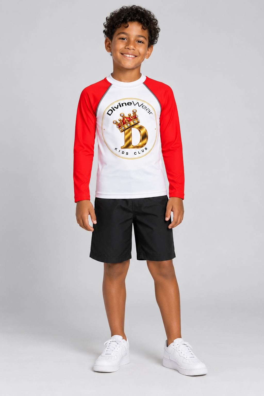 Brazilian youth model wearing DivineWear lil Red Prince rash guard with black shorts
