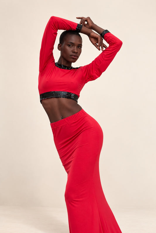 Red crop top and matching fitted skirt with black sequin trim, shown on model
