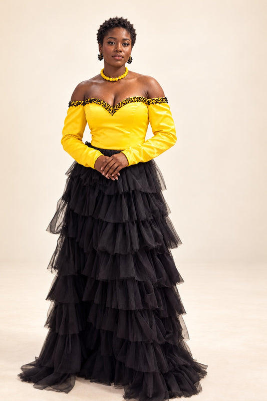 Yellow off-shoulder long-sleeve bodice with black trim and full-length black tiered tulle skirt