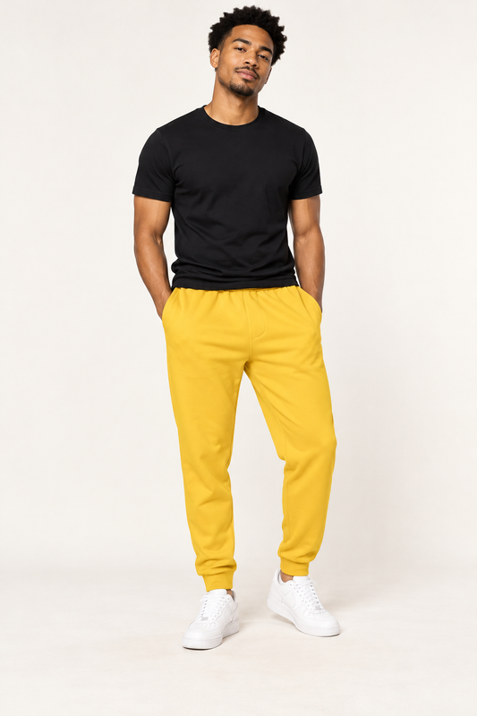 African American male model wearing DivineWear yellow joggers