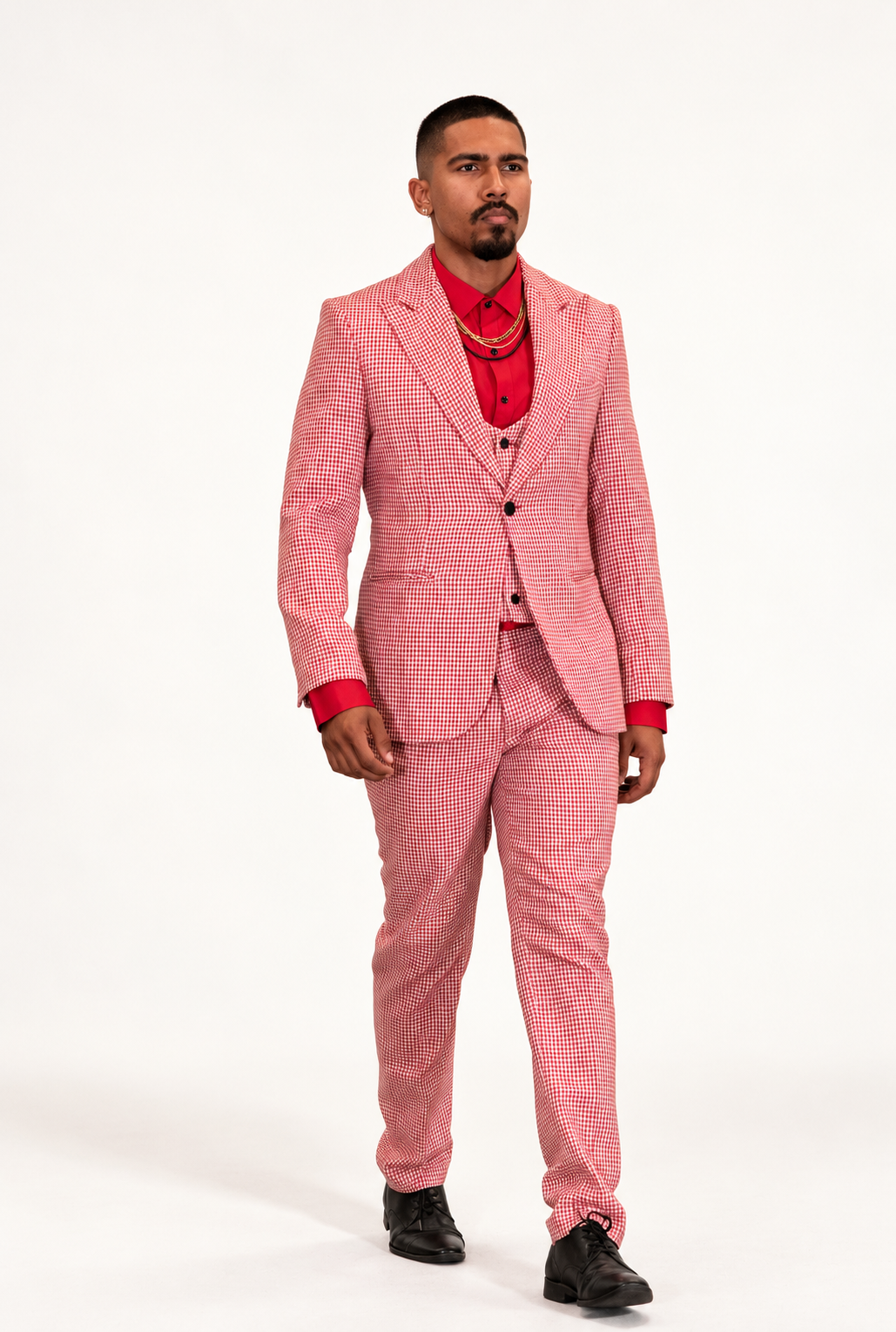 DivineWear red and white microcheck three-piece runway suit on the original male model