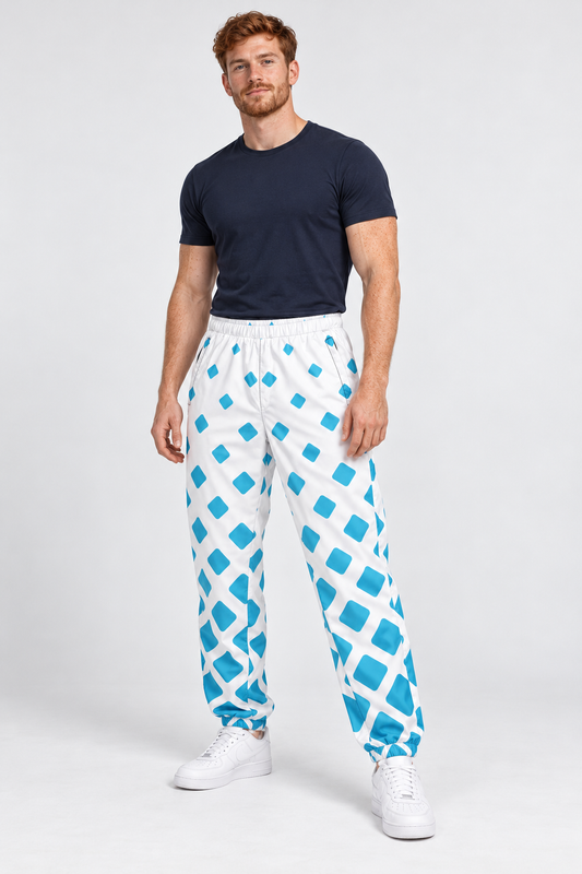 Scottish male model wearing DivineWear white and sky blue track pants